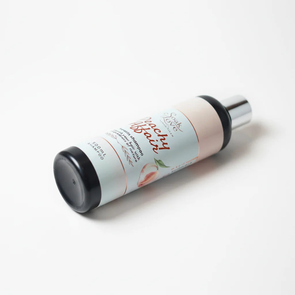 Soak in Love Peachy Affair Keratin Shampoo 500ml bottle displayed on a white background, formulated to cleanse, nourish, and smooth dry and damaged hair.
