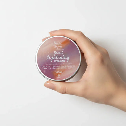 100ml Breast Tightening Cream in a cosmetic jar with a pink label, designed to moisturize and improve the appearance of firmer, smoother skin.