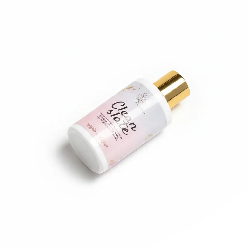 Bottle of Soak in Love Clean Slate Face Cleanser with a white and pink label and gold cap, designed to gently cleanse and refresh the skin.