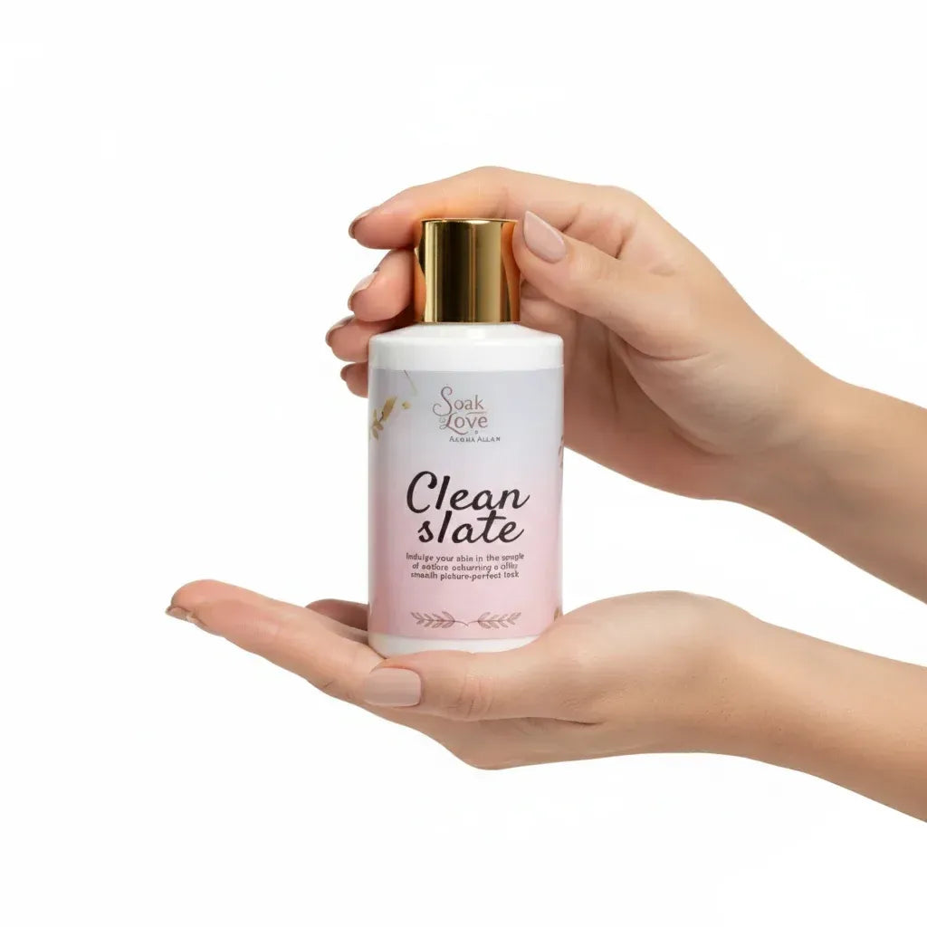 Bottle of Soak in Love Clean Slate Face Cleanser with a white and pink label and gold cap, designed to gently cleanse and refresh the skin.