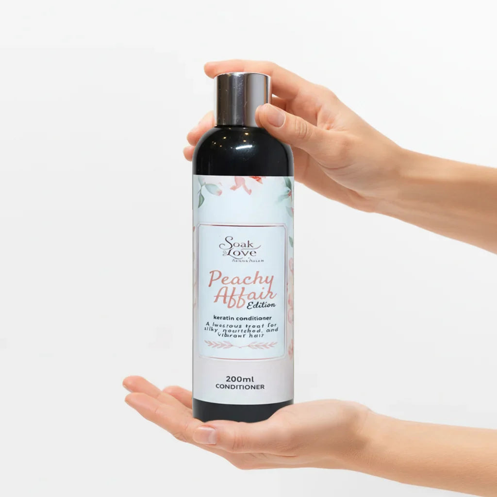 Soak in Love Peachy Affair Edition Keratin Conditioner 200ml bottle for dry, damaged, and frizzy hair on a white background.