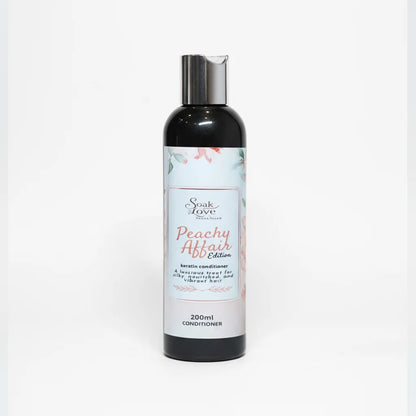 Soak in Love Peachy Affair Edition Keratin Conditioner 200ml bottle for dry, damaged, and frizzy hair on a white background.